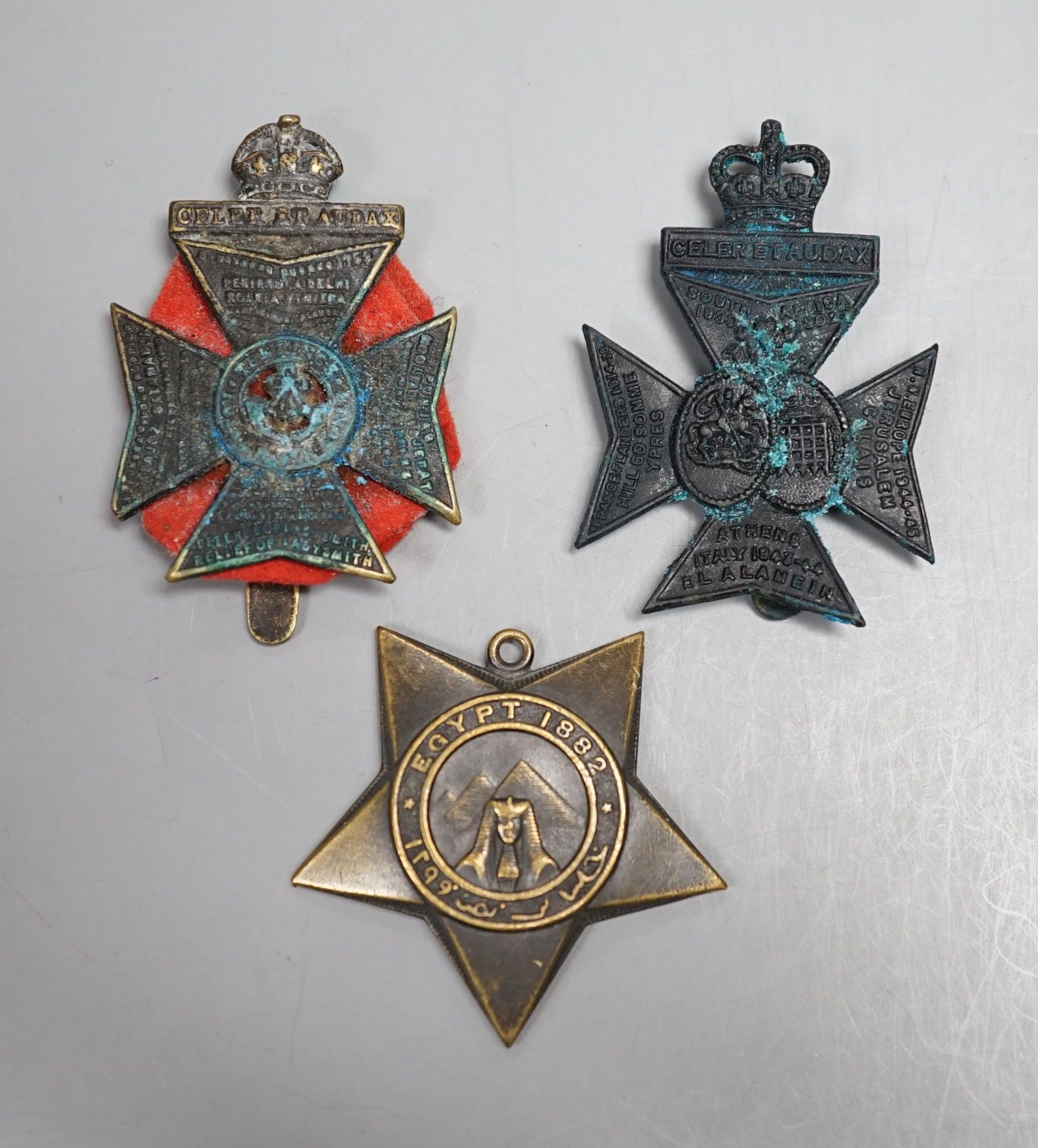 A Khedive's Star, Egypt 1882 and two cap badges.